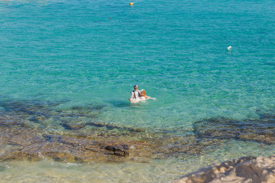 High angle view of people at sea shore