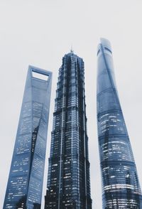 Low angle view of modern buildings against clear sky