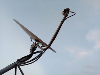 Low angle view of street light against sky