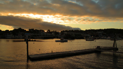 Scenic view of river against sky during sunset