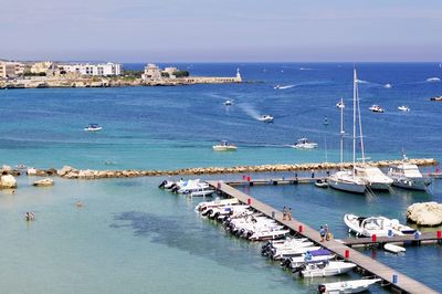 High angle view of boats moored at harbor