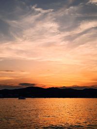 Scenic view of sea against romantic sky at sunset