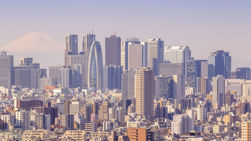 Tokyo, japan - february 11, 2016 / cityscape of tokyo in japan with fuji mountain as a background