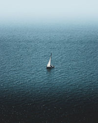 High angle view of sailboat sailing in sea