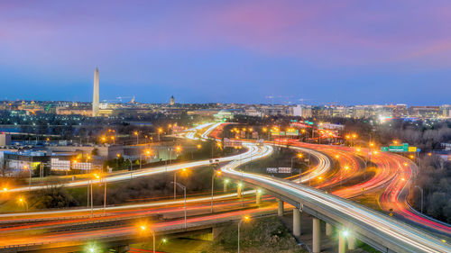 High angle view of light trails on road at night