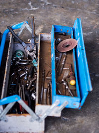 High angle view of work tools in box at workshop