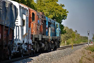 Train on railroad track against sky