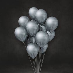 Close-up of balloons against black background