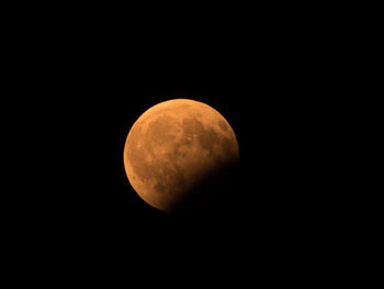 Low angle view of moon against sky at night