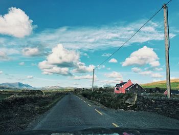 Road against sky seen through windshield