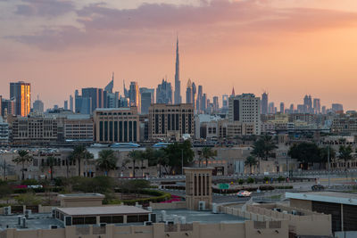 Cityscape against sky during sunset