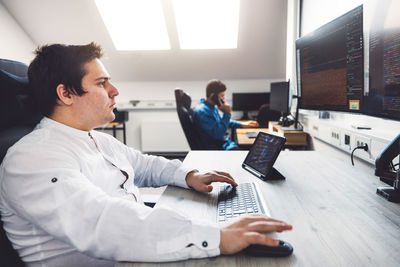 Midsection of businessman working at office