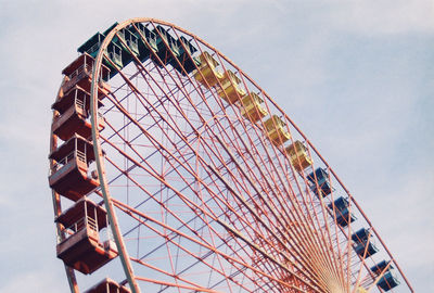 Low angle view of ferris wheel against sky