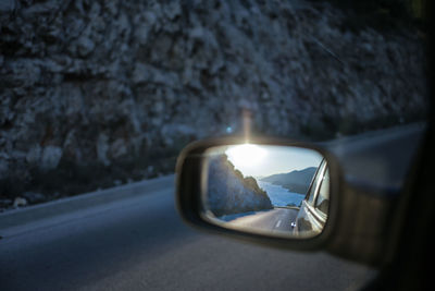 Reflection of car on side-view mirror