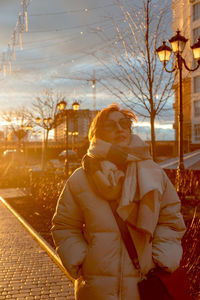 Rear view of woman standing in city