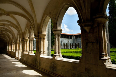 View of historical building seen through colonnade