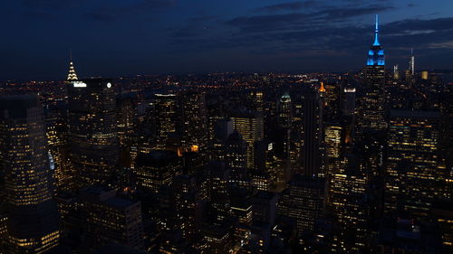 Illuminated buildings in city at night