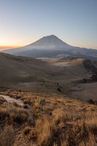 Scenic view of popocatepetl against sky during sunset