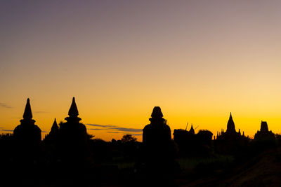 Silhouette of temple against sky during sunset