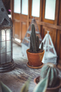 Close-up of electric lamp on table at home