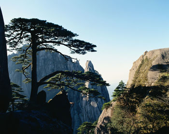 Low angle view of rock formations against sky