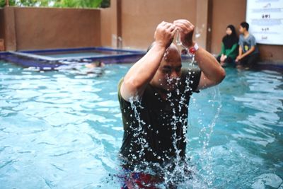 Man swimming in pool