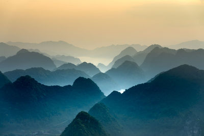 Scenic view of mountains against sky during sunset