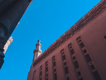 Low angle view of building against blue sky