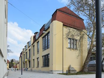 Street amidst buildings against sky