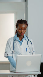 Doctor using computer on table