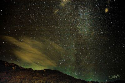 Scenic view of star field against sky at night