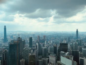 Aerial view of modern buildings in city against sky