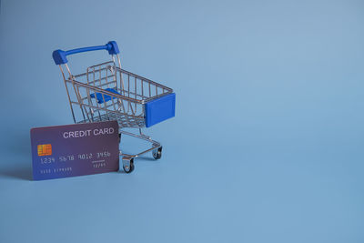 Low angle view of information sign against clear blue sky