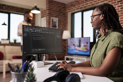 Young woman using laptop at home