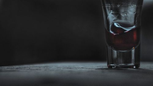 Close-up of wine in glass on table