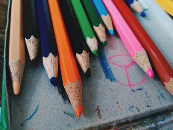 Close-up of colored pencils on table