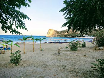 Scenic view of beach against clear sky