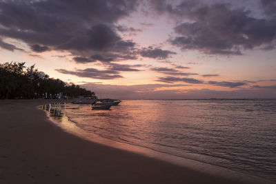 Scenic view of beach against sky during sunset