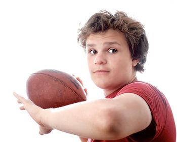 Portrait of boy with ball in background