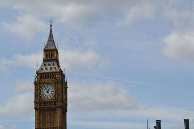 Low angle view of clock tower against sky