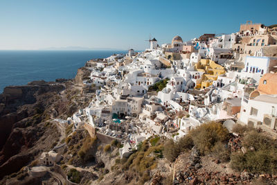 Aerial view of townscape by sea