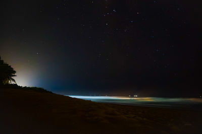 Scenic view of sea against sky at night