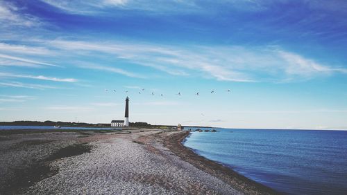 Scenic view of sea against blue sky