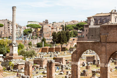 Old ruins at roman forum against sky