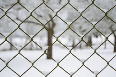 Full frame shot of chainlink fence against sky