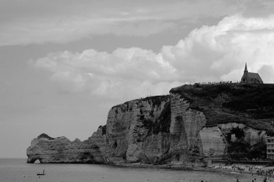 Scenic view of mountains against cloudy sky