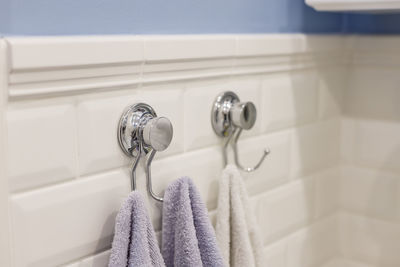 Close-up of bathroom hanging on wall at home