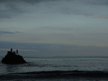 Scenic view of sea against sky at sunset