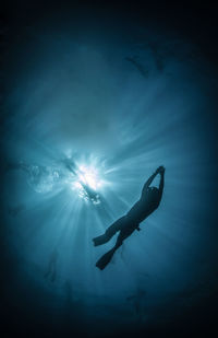 Full length view of scuba diver underwater