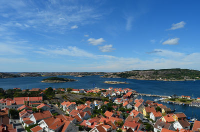 Townscape by sea against sky